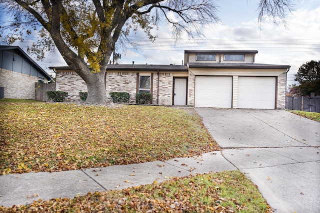 view of front of house with a garage and a front lawn