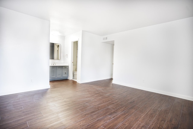 unfurnished room with dark hardwood / wood-style floors