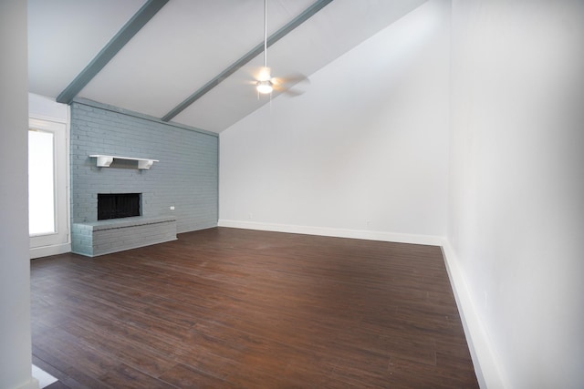 unfurnished living room with vaulted ceiling with beams, ceiling fan, a fireplace, and dark hardwood / wood-style floors