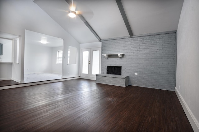 unfurnished living room featuring high vaulted ceiling, ceiling fan, dark hardwood / wood-style floors, beam ceiling, and brick wall