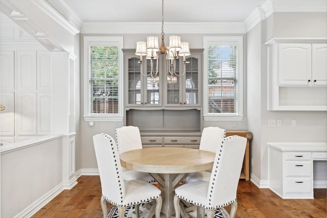 dining room featuring dark hardwood / wood-style floors, an inviting chandelier, and ornamental molding