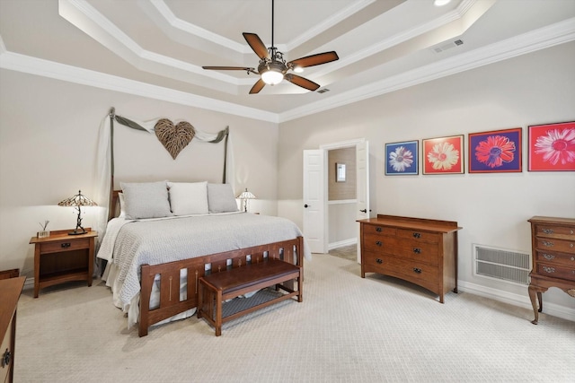 carpeted bedroom featuring a raised ceiling, ceiling fan, and crown molding