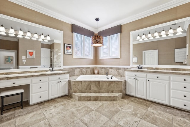 bathroom with vanity, ornamental molding, and tiled tub