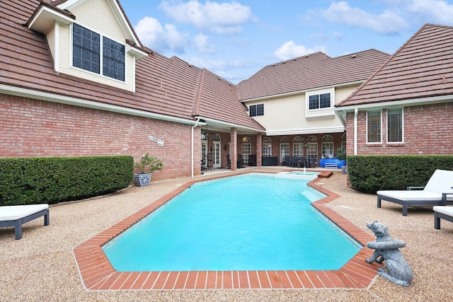 view of swimming pool featuring a patio