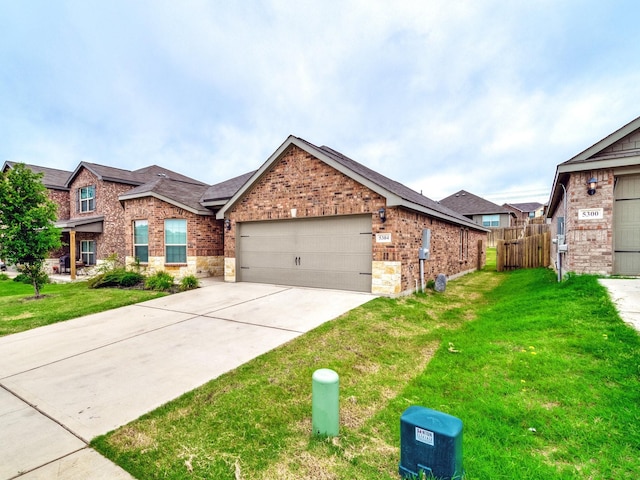 view of front of house featuring a front lawn and a garage