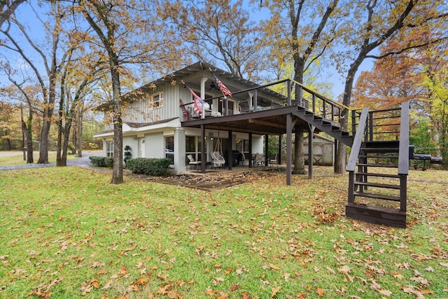 exterior space featuring a yard, a patio, and a wooden deck