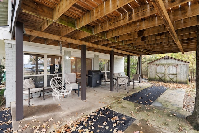 view of patio featuring area for grilling and a shed