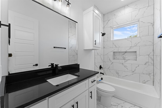 full bathroom featuring tiled shower / bath, vanity, and toilet