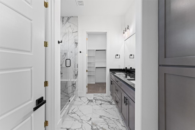 bathroom with vanity and an enclosed shower