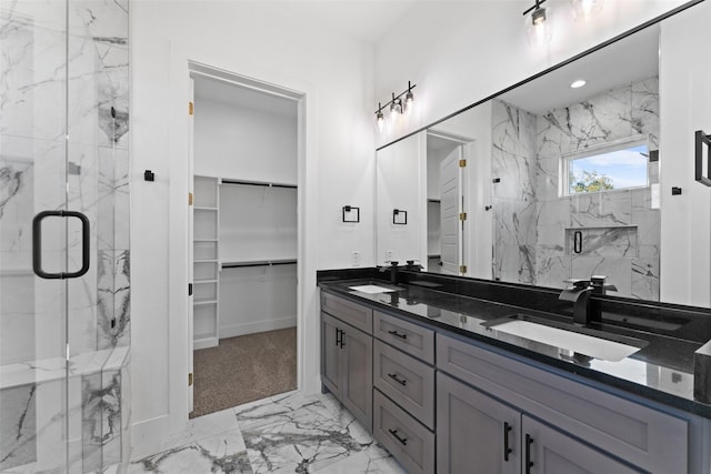 bathroom with vanity and a shower with shower door