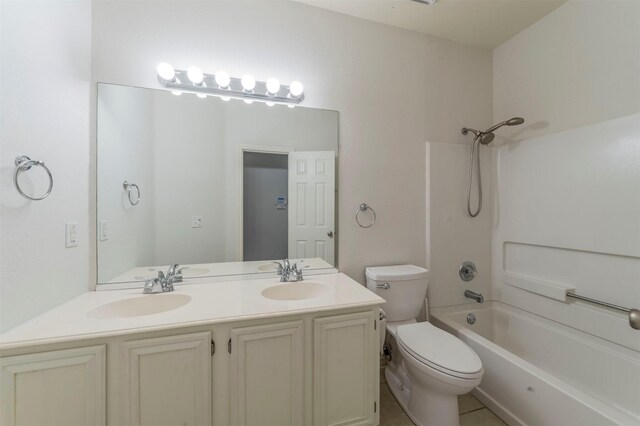 full bathroom with washtub / shower combination, vanity, and toilet