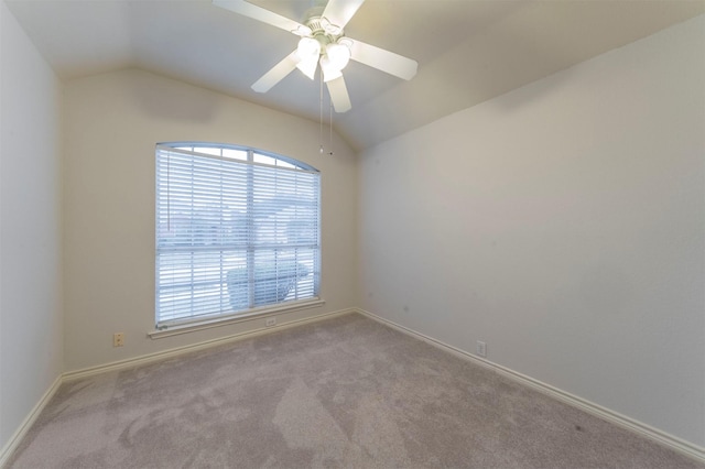 unfurnished room featuring ceiling fan, light colored carpet, and lofted ceiling