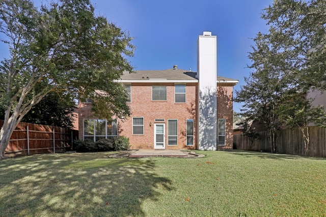 back of house with a lawn and a patio area