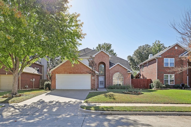 front of property featuring a front yard and a garage