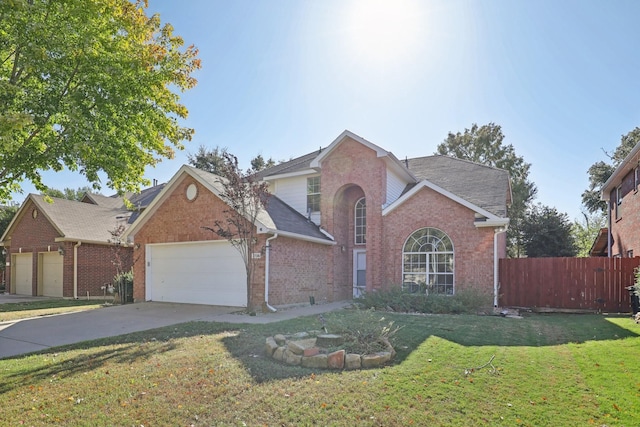 front facade featuring a garage and a front lawn