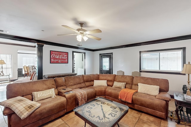 tiled living room with ornamental molding, plenty of natural light, and ceiling fan