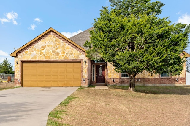 view of front facade featuring a garage and a front lawn