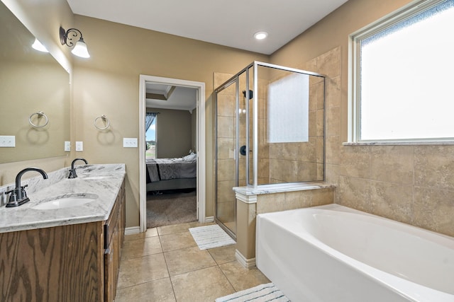 bathroom with shower with separate bathtub, vanity, tile patterned floors, and a healthy amount of sunlight