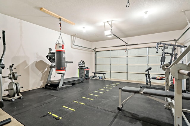 workout room with a textured ceiling