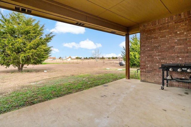 view of patio with a rural view