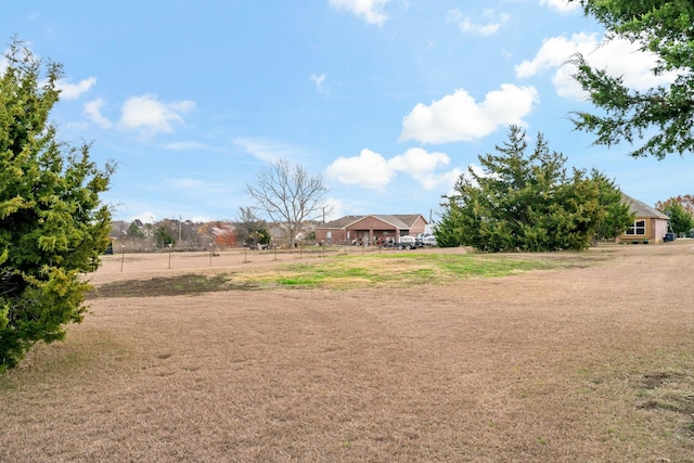 view of yard with a rural view