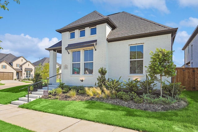 view of front of house with a front lawn