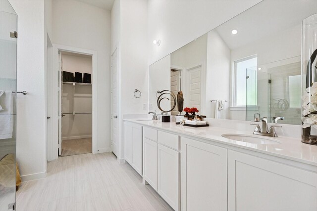 bathroom with vanity and an enclosed shower