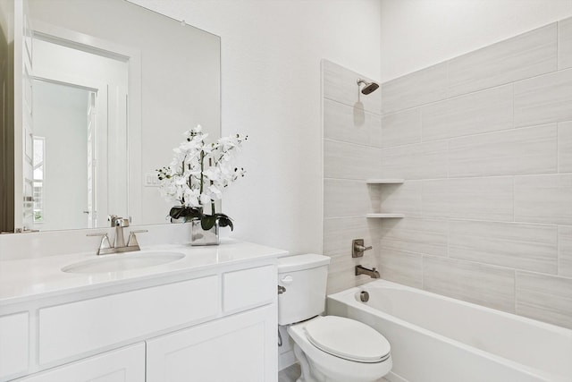 full bathroom with vanity, toilet, and tiled shower / bath