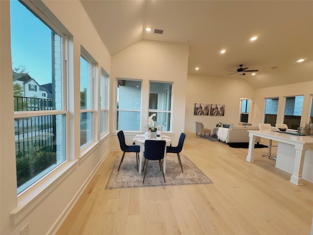 dining room featuring light wood-type flooring and a wealth of natural light