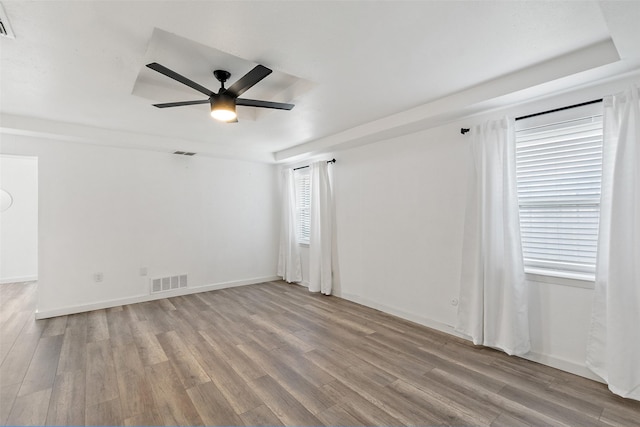 spare room with light hardwood / wood-style flooring and ceiling fan