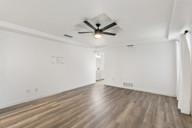 empty room with hardwood / wood-style floors and ceiling fan