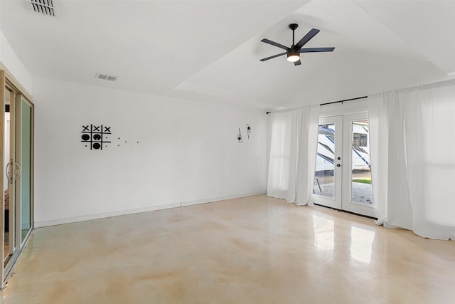 empty room featuring ceiling fan, vaulted ceiling, and french doors