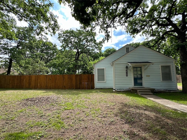 view of front of property with a front lawn