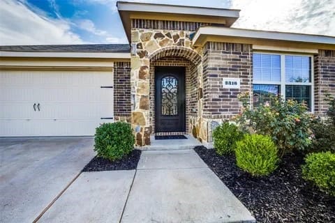 view of exterior entry featuring a garage