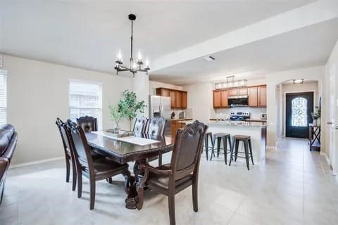 dining area featuring a chandelier and a wealth of natural light