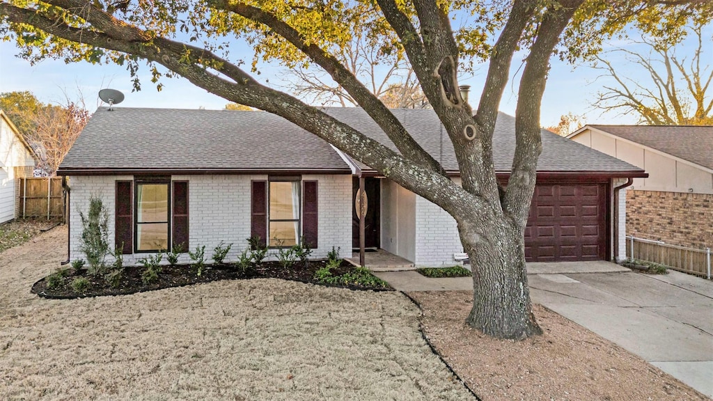 single story home featuring a garage