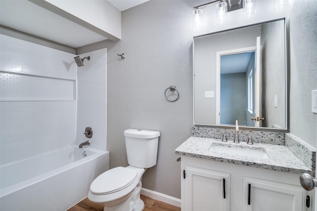 full bathroom featuring shower / bathing tub combination, hardwood / wood-style floors, vanity, and toilet