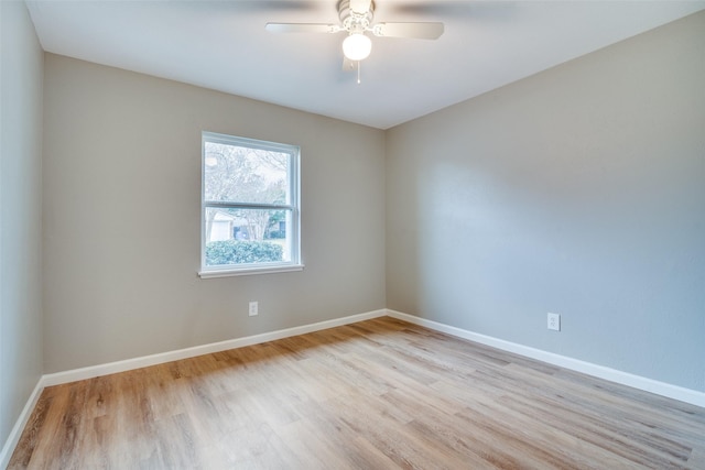 spare room featuring ceiling fan and light wood-type flooring