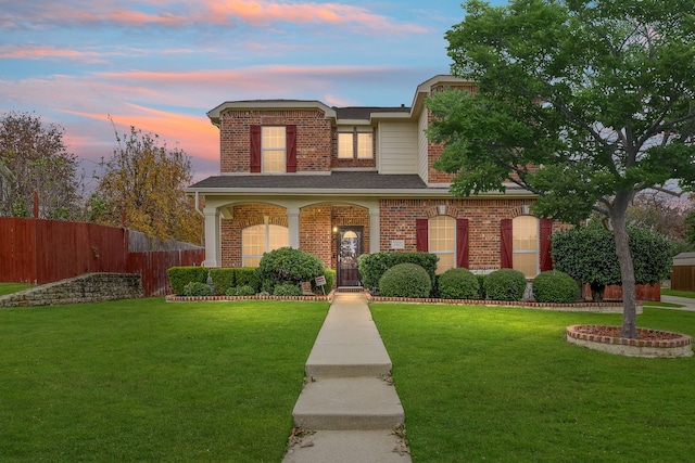 view of front of house with a yard