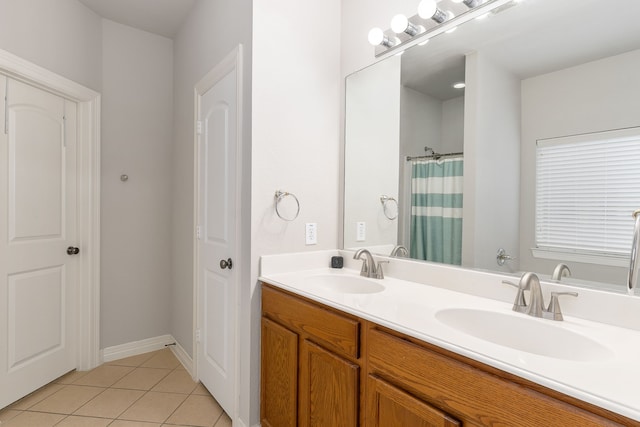 bathroom with vanity, tile patterned floors, and walk in shower