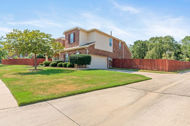 view of home's exterior featuring a lawn and a garage