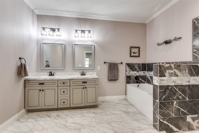 bathroom with vanity, crown molding, and a tub