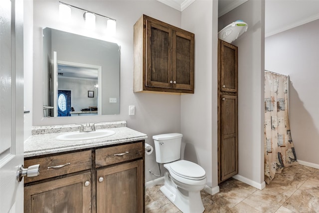 bathroom featuring tile patterned flooring, vanity, ornamental molding, and toilet