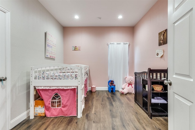 bedroom with wood-type flooring