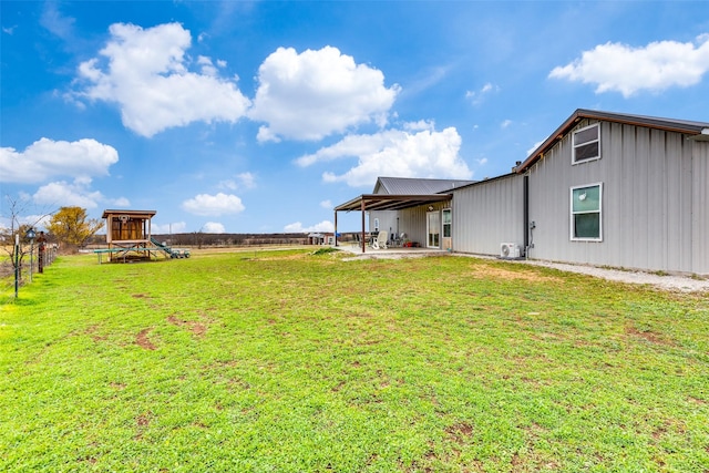 view of yard with a playground and a patio area