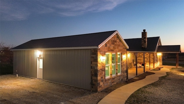 view of outdoor structure at dusk