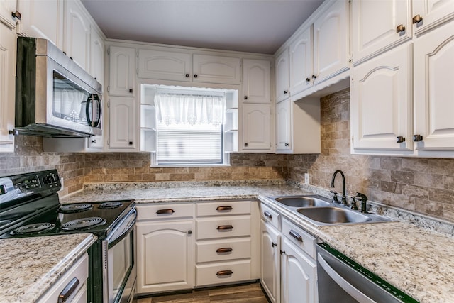 kitchen featuring sink, stainless steel appliances, and white cabinets