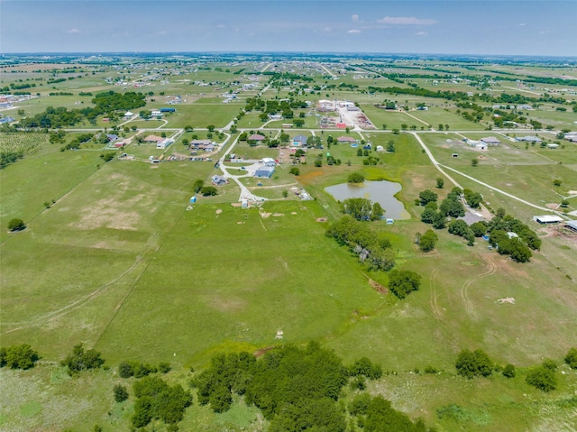 drone / aerial view with a rural view and a water view