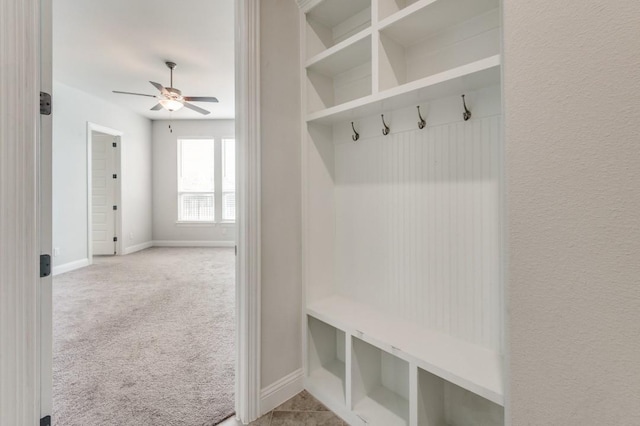 mudroom featuring ceiling fan and light colored carpet