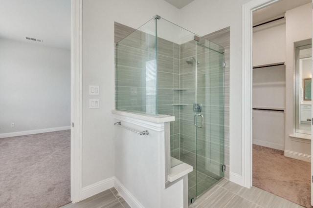 bathroom featuring an enclosed shower